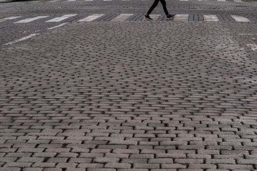 Empty street with a pedestrian walking