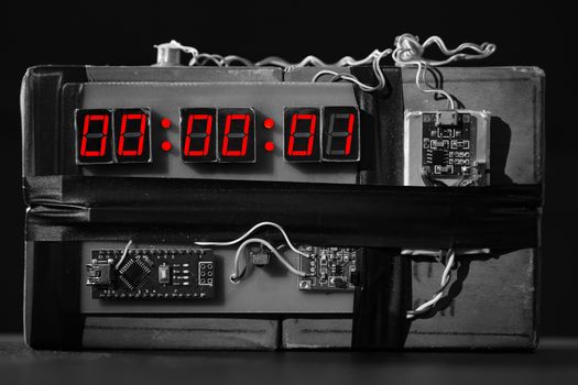 bw. Bomb with a Red Timer on Black Background. Dynamite is Going to Explode or Detonate per 1 Second. Time Bomb with Clockwork. Terrorist Threat. Explosives with Detonator. Improvised Explosive Device