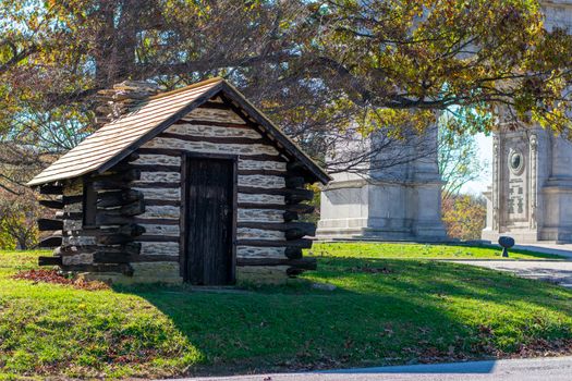 A Reproduction Log Hut at Valley Forge National Historical Park With the National Memorial Arch in the Background