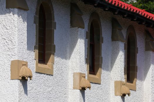 Windows facade wall of a small village church building, Mossel Bay, South Africa