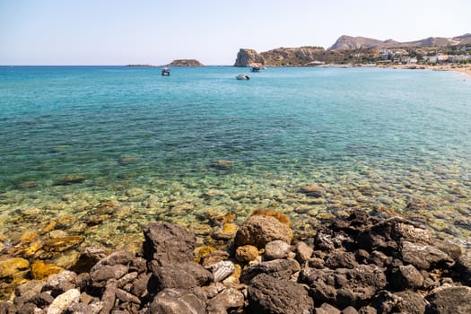 Stegna beach on Greek island Rhodes with rocky coastline and clear turquoise water on a sunny  day in spring