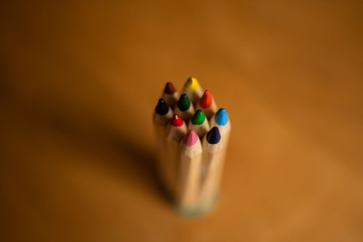 Pencils of different colors grouped together