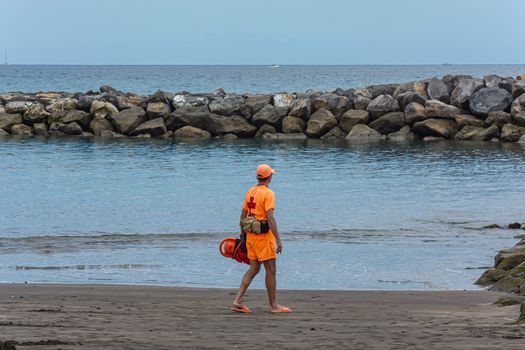 Tenerife, Spain - 05/110/2018: Lifeguards on a deserted beach and a yellow flag. blurry background. Stock photo