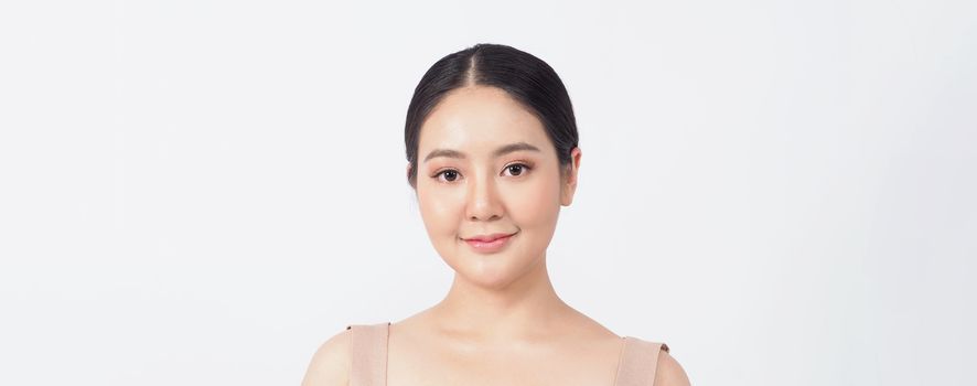 Young asian woman beauty face make up for skincare cosmetic and showing natural wellness soft and firm and ageless facial skin. she younger-looking or youthful. studio shot white background.