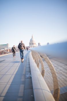 People Walking Along the Bridge Toward St Pauls Cathedral in London, UK