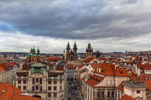 Aerial view of Prague old town and cityscape with church of Our Lady before Tyn on the Old Town Square on a cloudy day from top of Clementinum, Prague, Czech Republic