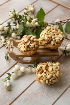 Muffins with peanut on white shabby background, vertical image