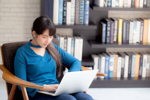 Business young asian woman freelance work on display laptop computer on chair, businesswoman check email, asia girl searching to internet communication and business concept.