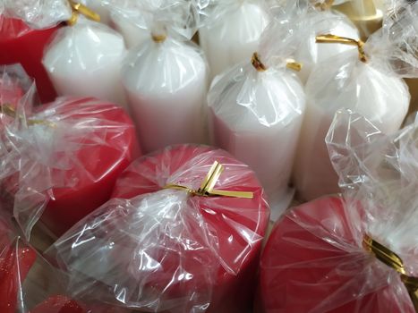 Festive decorations in the covid period of Christmas 2020, colored candles in transparent bags