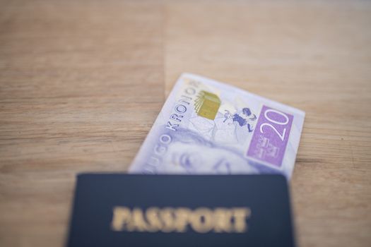 Picture of a Twenty Swedish Kronor Banknote Inside a blurry United States of America Passport