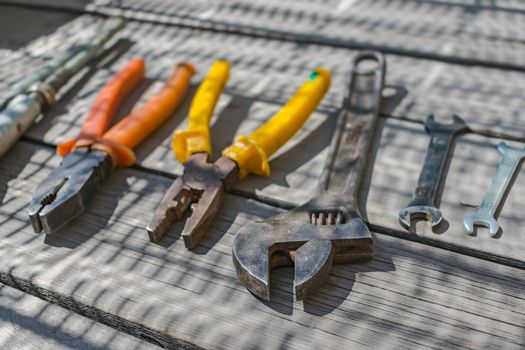 Set of construction and household tools with pliers and wrenches