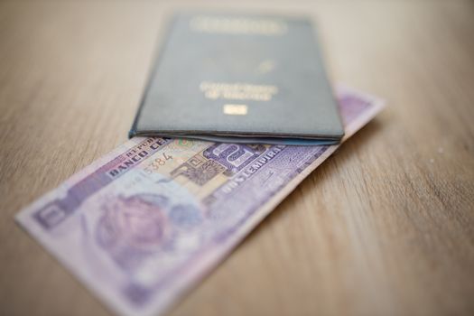 United States of America Passport with a Two Honduran Lempiras Bill partially inside it