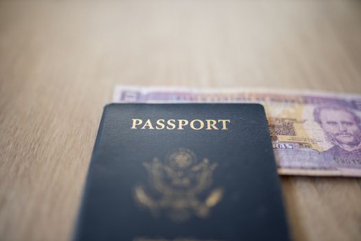 United States of America Passport with a Two Honduran Lempiras Bill partially under it, showing the face of Marco Aurelio Soto