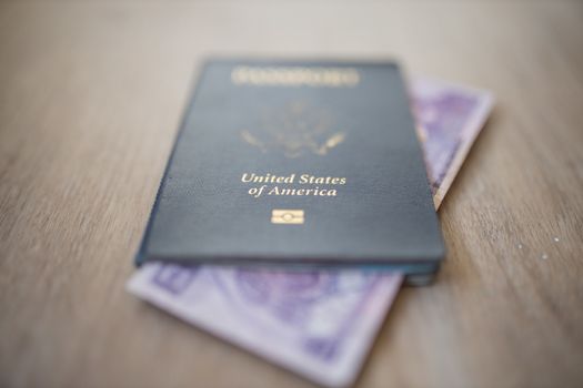 Picture of the corner of a Blurry Two Honduran Lempiras Bill shown from inside a United States of America Passport