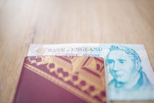 Picture of Half a Five Pound Note inside a Swedish passport