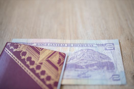 Picture of a Swedish Passport with a Two Honduran Lempiras Bill partially inside it