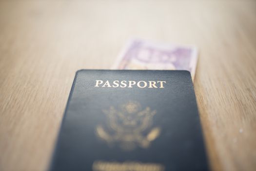 United States of America Passport with a Blurry Two Honduran Lempiras Bill partially under it