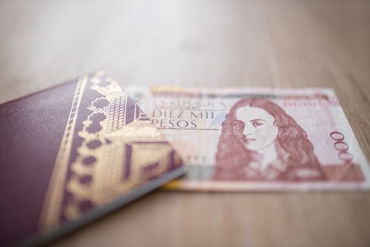 Swedish Passport with half a 10.000 Colombian Pesos Bill Inside
