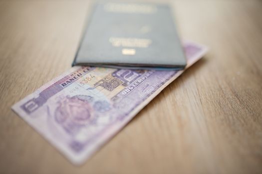 United States of America Passport with a Two Honduran Lempiras Bill partially inside it