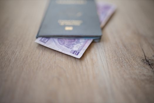 Picture of the corner of a Two Honduran Lempiras Bill shown from inside a United States of America Passport