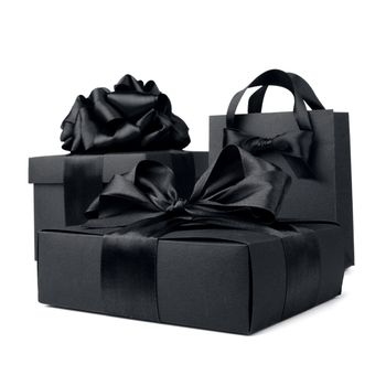 Concept sales, shopping, black friday. Paper shopping or gift bag box with silk ribbon bow isolated on white background