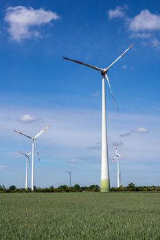 Wind turbines in a grain field seen in Germany
