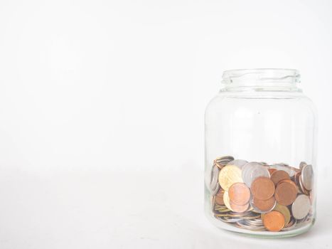 Savings in a jar save money To save more money in the future White background