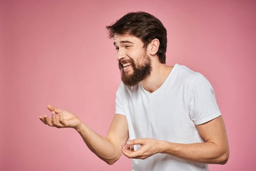 cheerful bearded man white t-shirt emotions cropped view pink background. High quality photo