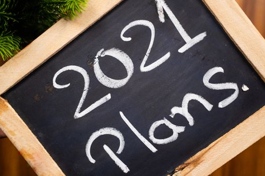 Hand Written 2021 plans on school slate - Concept of new year 2021 planning