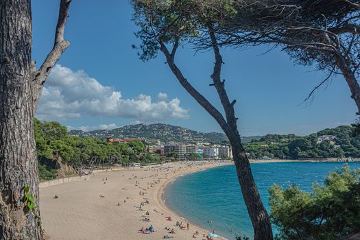 Seascape. Sandy beach of the Mediterranean sea (Lloret de Mar, Spain). Stock photo.