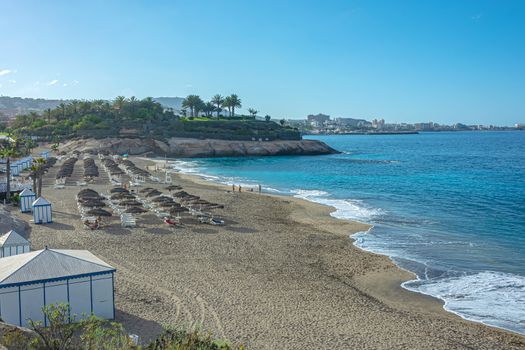 Ocean sand Beach Del Duque (Tenerife, Spain). Stock photo.
