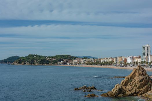 Seascape. The beach and coastline of the resort of Lloret De Mar (Spain). Stock photo