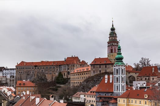Beautiful view of Český Krumlov castle and the castle tower with St. Jost church in old town of Cesky Krumlov on a cloudy day, Czech Republic