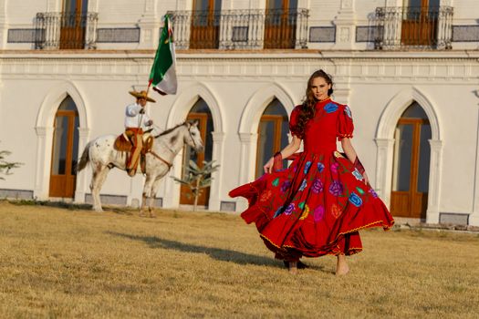 A gorgeous Hispanic Brunette model poses outdoors in home environment