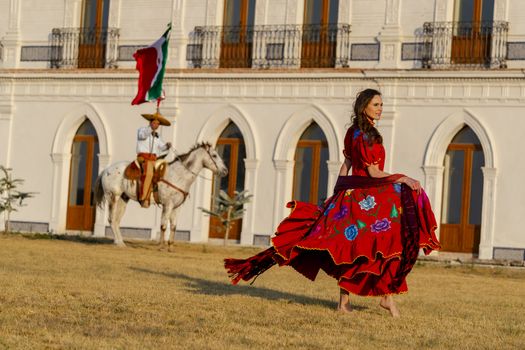 A gorgeous Hispanic Brunette model poses outdoors in home environment