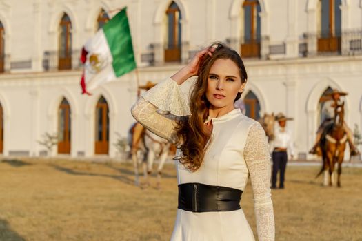 A gorgeous Hispanic Brunette model poses outdoors in home environment