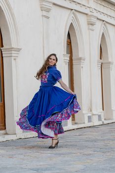 A gorgeous Hispanic Brunette model poses outdoors at a Mexican hacienda