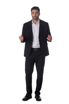 Full length portrait of young handsome business man in black suit holding something in hands studio isolated on white background