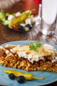 greek Pastitsio dish on a blue plate