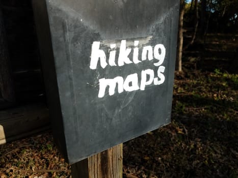 hiking maps sign on old black metal mail box