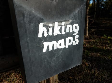 hiking maps sign on old black metal mail box