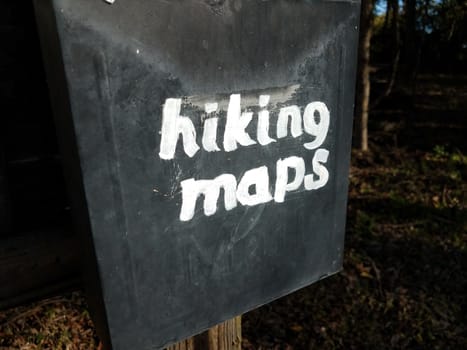 hiking maps sign on old black metal mail box