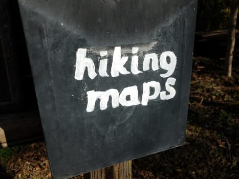 hiking maps sign on old black metal mail box