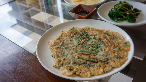 Pajeon is Korean savory pancake made from Batter with scallion.