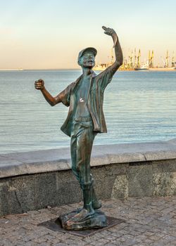 Berdyansk, Ukraine 07.23.2020. Monument to the fisherman on the embankment of Berdyansk, Ukraine, on an early summer morning