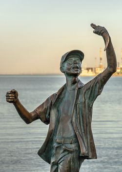 Berdyansk, Ukraine 07.23.2020. Monument to the fisherman on the embankment of Berdyansk, Ukraine, on an early summer morning