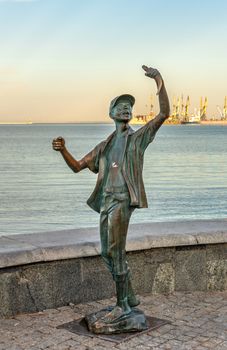 Berdyansk, Ukraine 07.23.2020. Monument to the fisherman on the embankment of Berdyansk, Ukraine, on an early summer morning