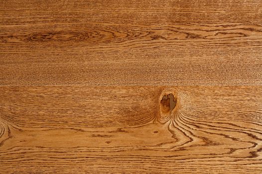 A beautiful pattern of oak wood grain in the form of a smooth wooden surface with horizontal lines.