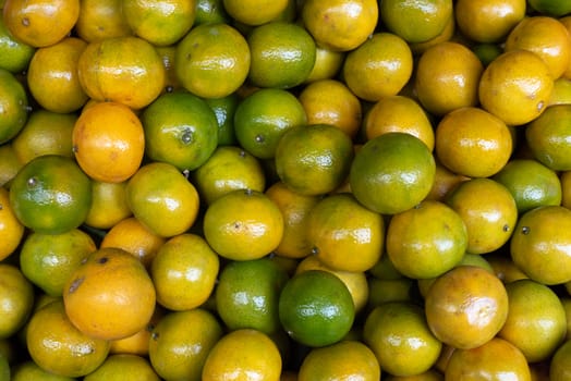 Yellow and green lemon heap ina street market in Chengdu, Sichuan province, China