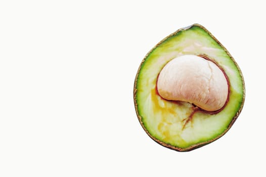 Avocado cut of half on a white background.